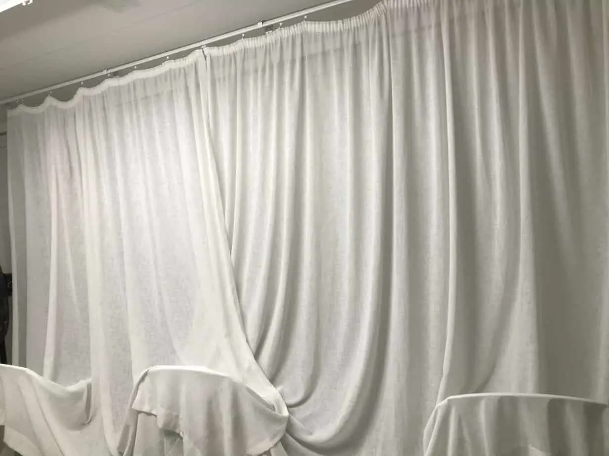 Rehang and review during curtain cleaning